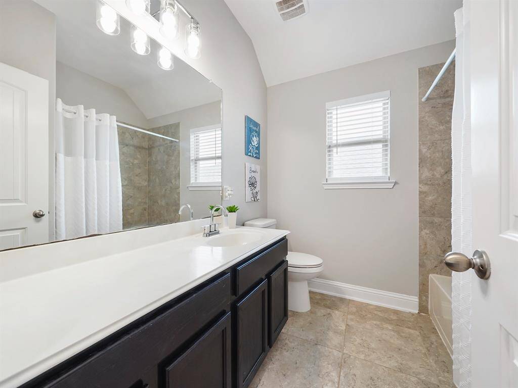 Upstairs, discover the convenience of two thoughtfully designed secondary bathrooms, ensuring comfort and ease for family and guests alike.