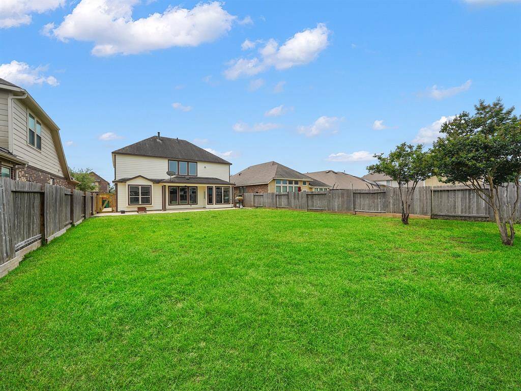 Imagine endless possibilities in your expansive backyard! Featuring tons of vibrant green space, this property offers the ideal setting for entertaining, gardening, or simply enjoying the tranquility of nature right outside your door.