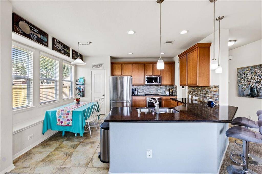 Beautiful large eat in kitchen complete with breakfast bar