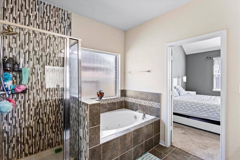 Spa-like primary bath with separate tub and shower