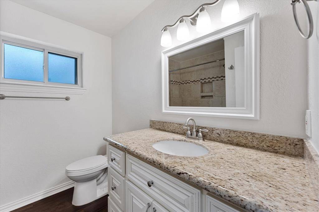 Second full bath, ample storage and privacy window.