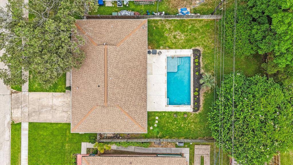 Aerial view of the home nestled under the trees