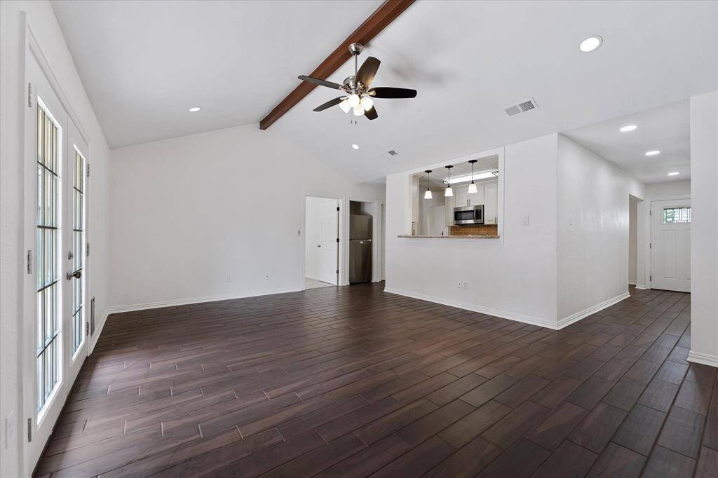 Living room with double French doors to the patio