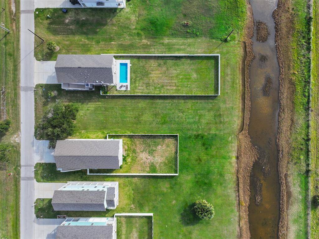 Birdseye view of the house and the extra lot.