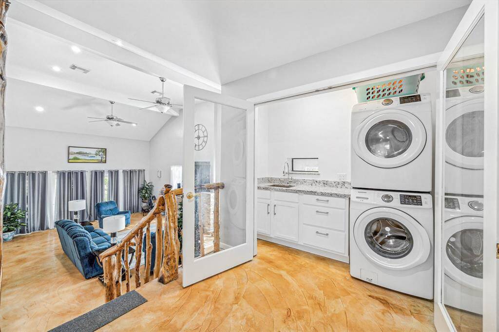 Laundry includes a sink with granite counter. Laundry is located on HALF level.