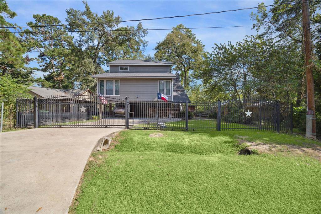 Home features beautiful curb appeal and two access gates. Look at that roof!