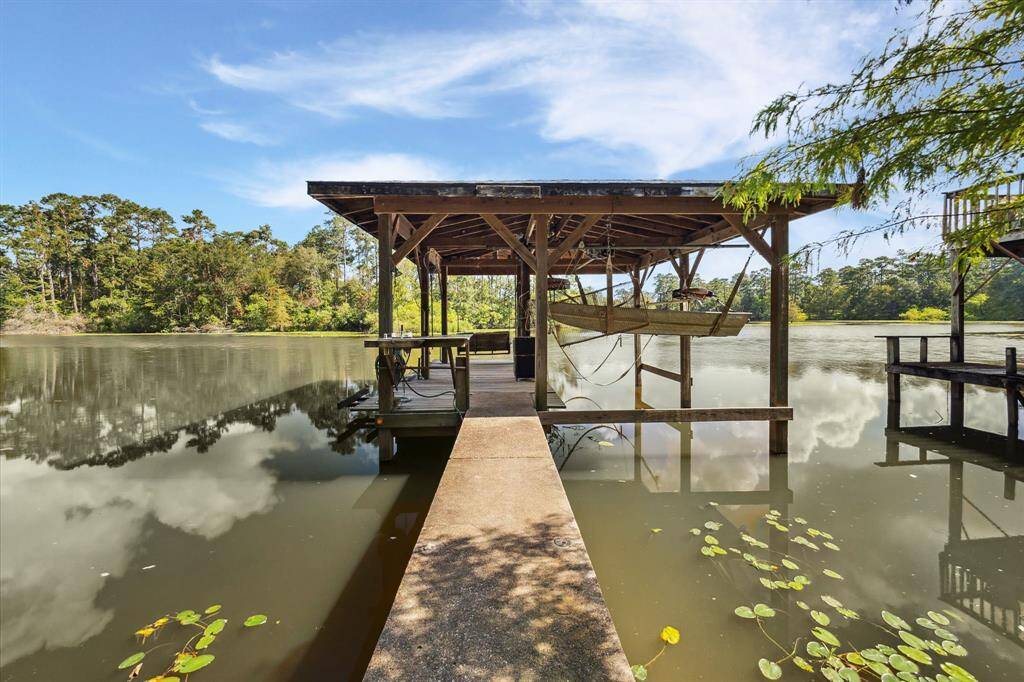 Boat house. Roof Aug 2024. Luce Bayou is wide and deep - no issues getting boat out on water.
