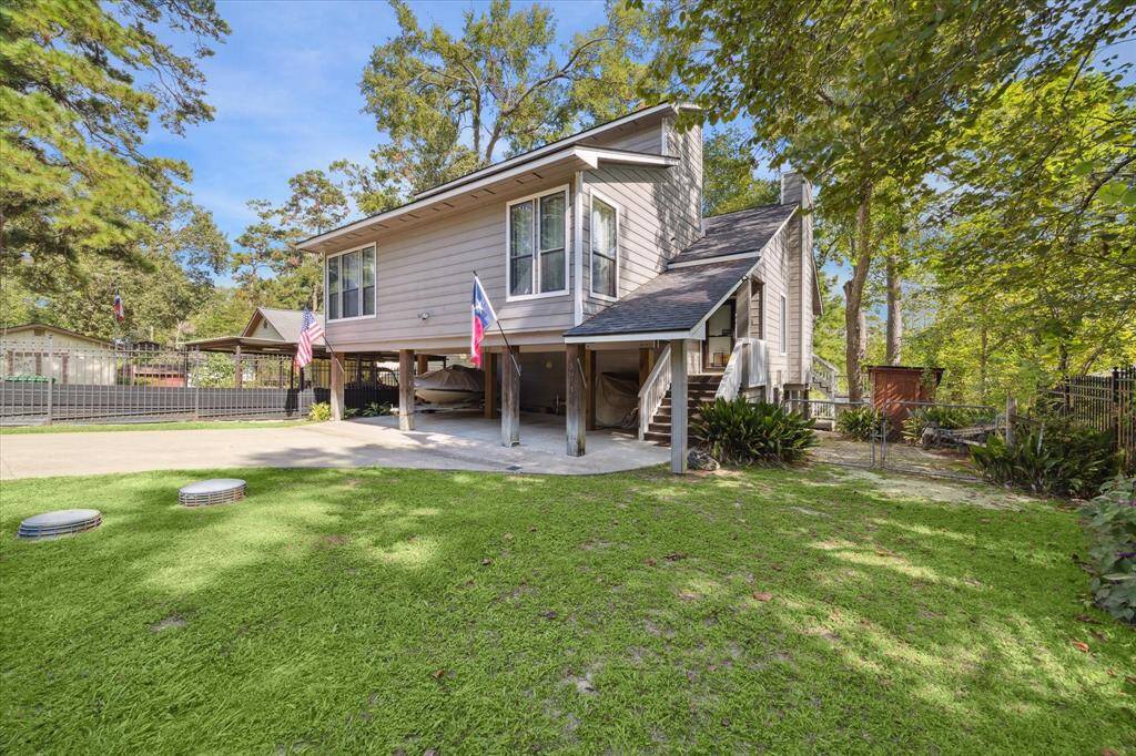 Front yard is fully fenced. Covered parking for watercraft or cars. Yard storage on the side of the main entrance. *Watercraft not included.