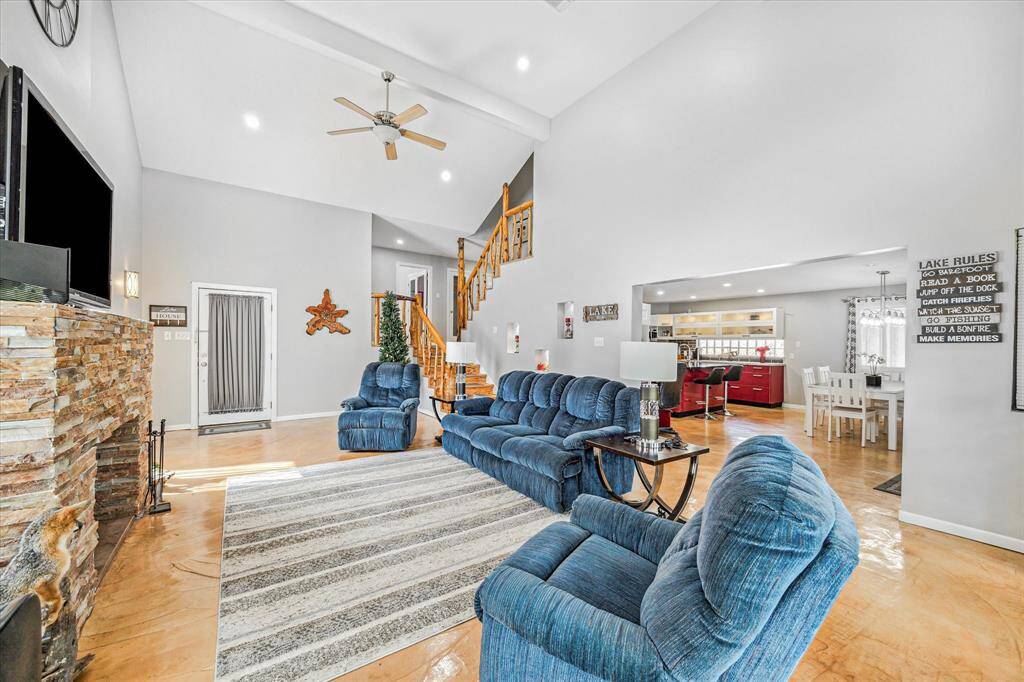 Living room opens to dining and kitchen.