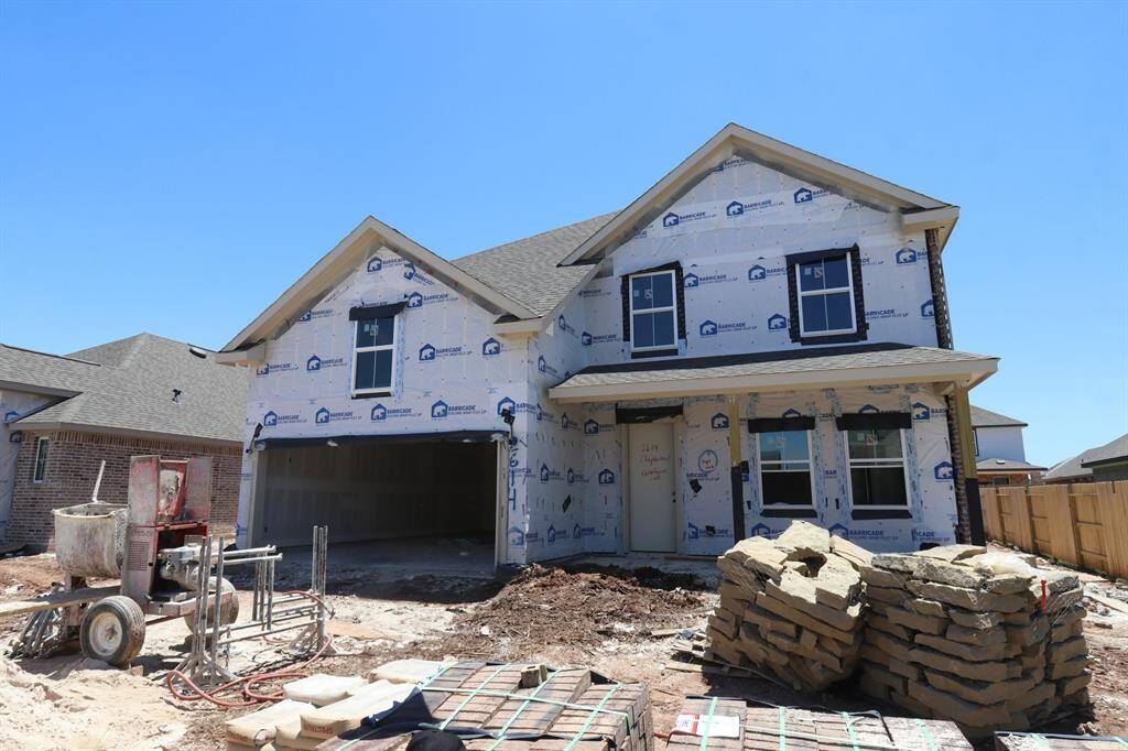Two story home with 4 bedrooms, 3.5 baths, and 2 car garage.
