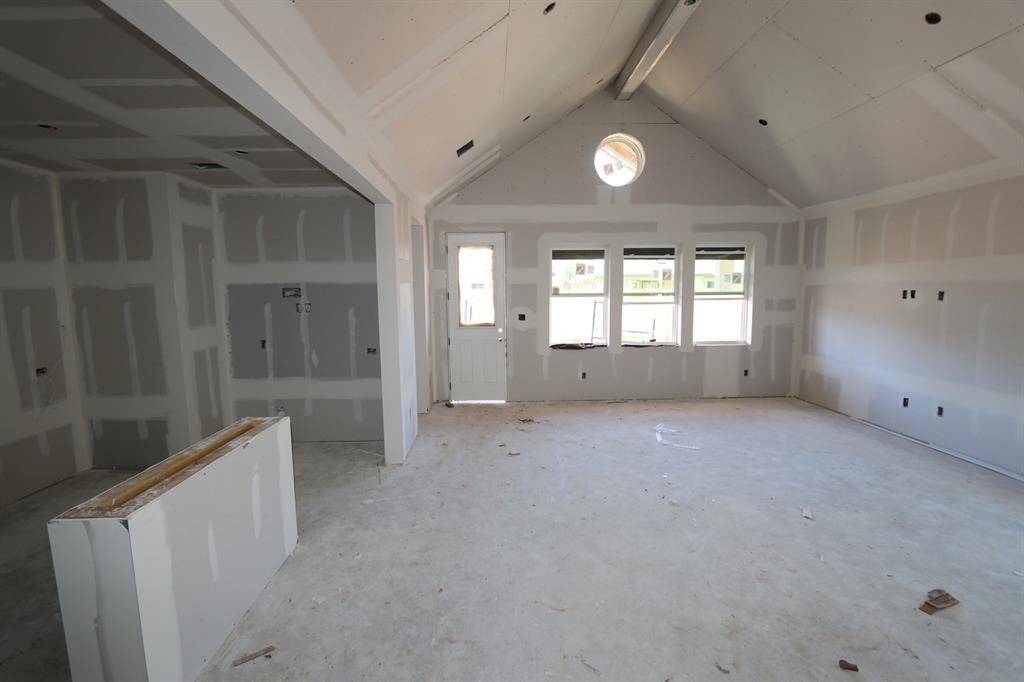 Kitchen island overlooks great room and dining area - still under construction!