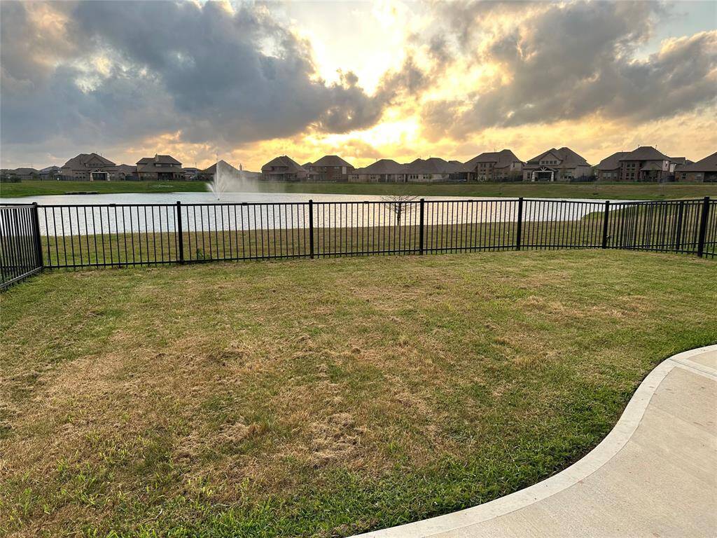 Water feature off back yard with sunsets views