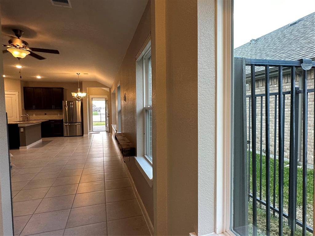 Entry walk way is filled with natural light.