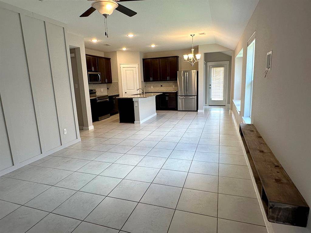 Kitchen / dining area leading to back door.
