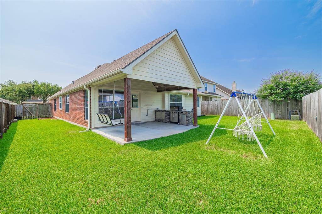 Step outside to enjoy a covered patio and a nicely sized backyard—ideal for relaxing or entertaining.