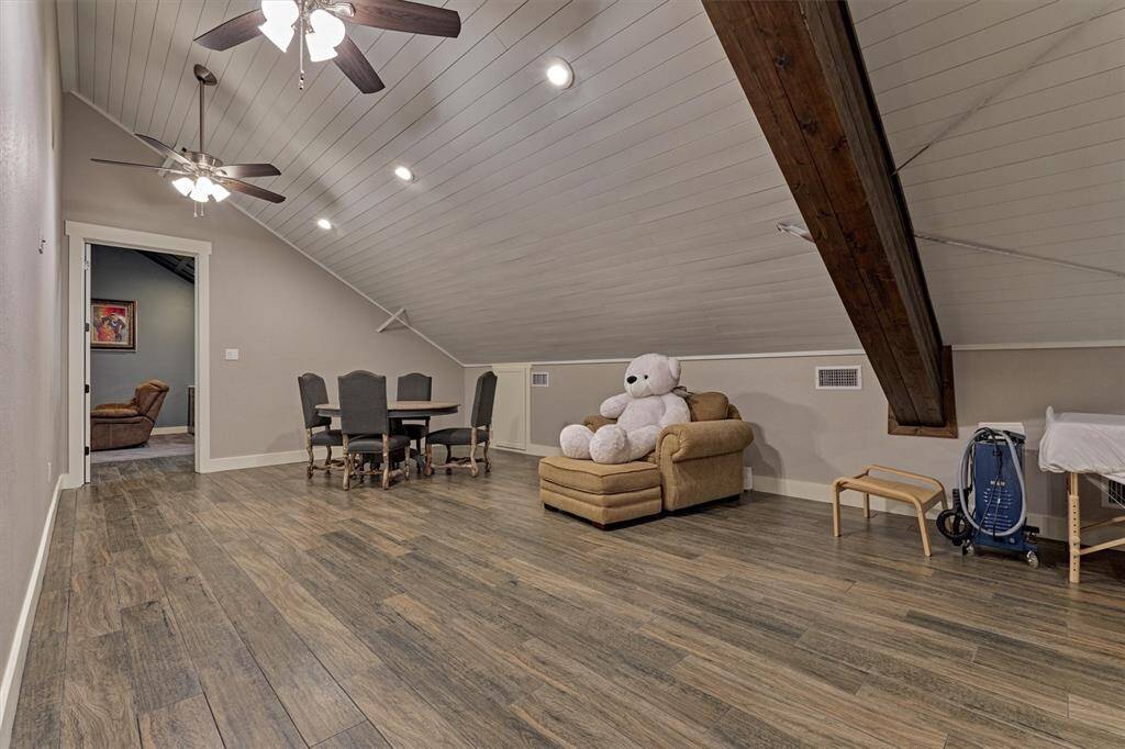 A spacious game room on the second floor offers the ultimate flex space to suit your lifestyle. Whether you envision a pool table, second living area, craft room, or playroom, the possibilities are endless in this versatile and inviting area.
