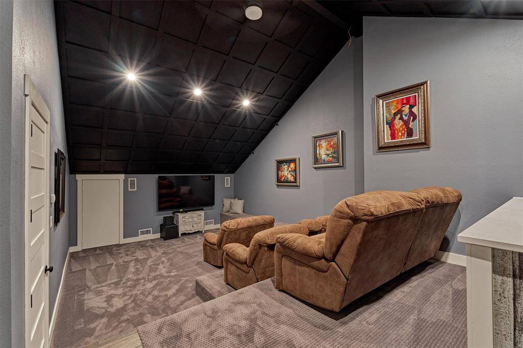 Enjoy movie nights or game day in style! The media room features tiered seating, ensuring a great view from every seat.