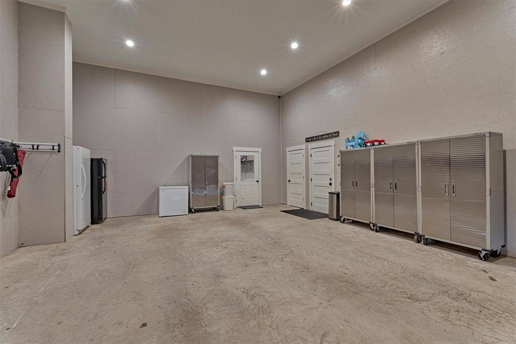 The garage has access to the home gym, a closet that is already plumbed for a sink, and doorway to the kitchen of the home.