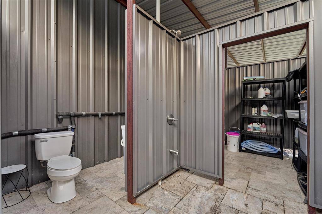 A full outdoor bath is convenient for showering off after a day in the pool or working up a sweat outside.