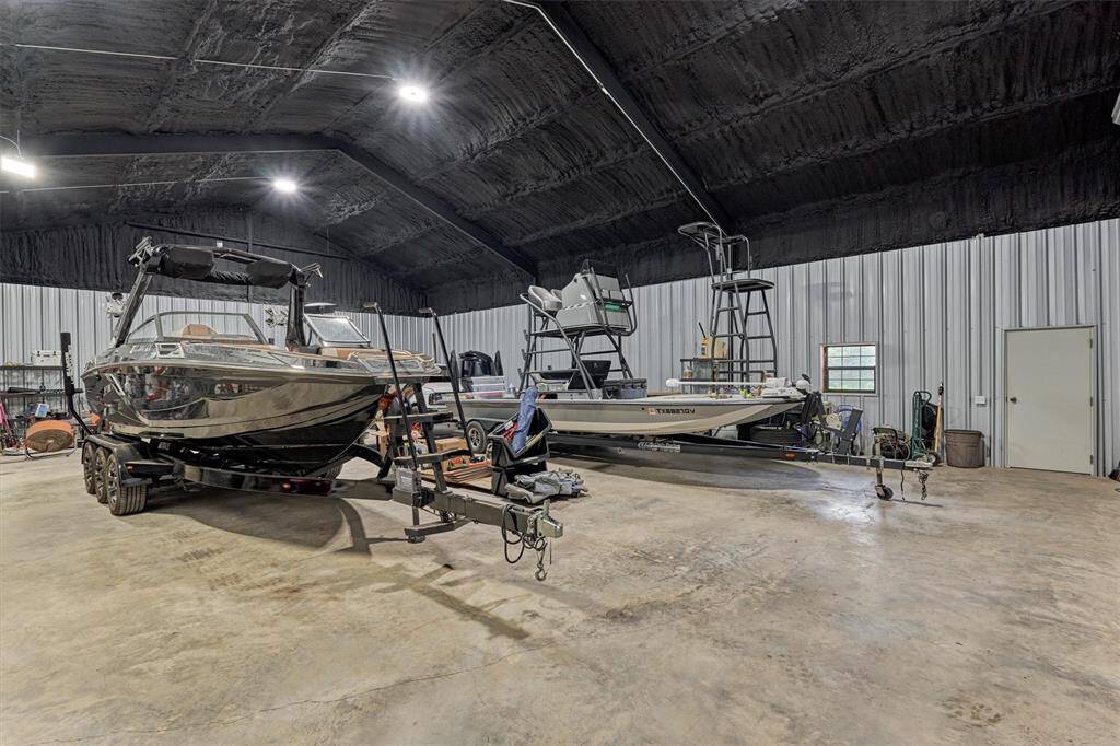 The separate insulated shop measures 40' x 60', offering ample space to store farm equipment, boats, an RV, or other large items—all protected and comfortable year-round.