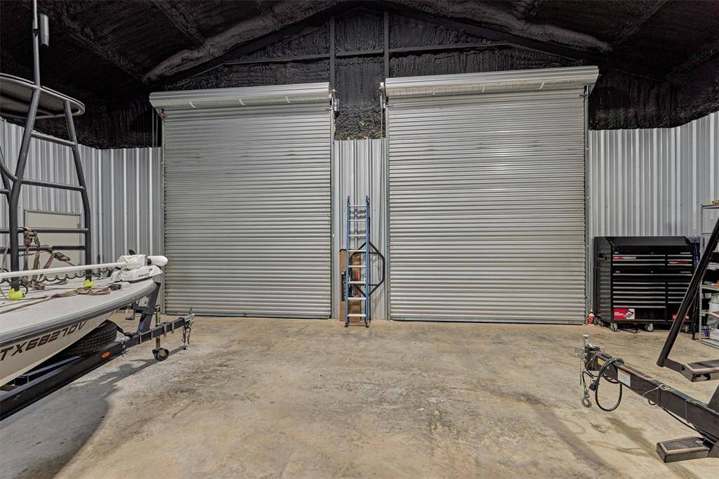 Double roll up doors to the shop measure 12' wide and 14' high.