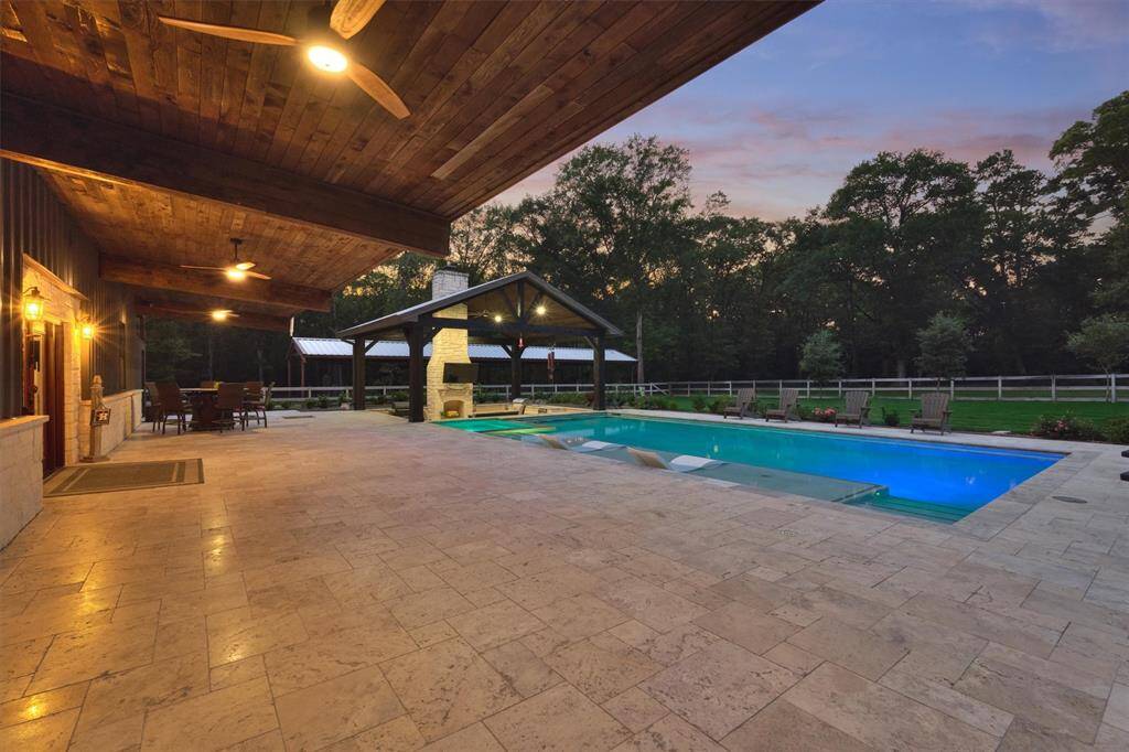 The thoughtfully cantilevered porch offers a covered outdoor space that provides shade and protection while maintaining unobstructed views of the surrounding landscape.