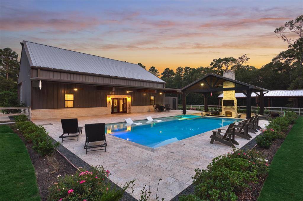 Travertine tile surrounds the pool, offering an elegant look while remaining cool underfoot, even on sunny days.