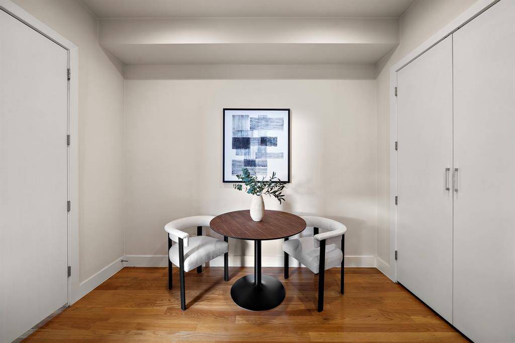 Clean-lined breakfast nook tucked between spacious storage closets offers an efficient spot for casual dining, morning coffee, or working from home.