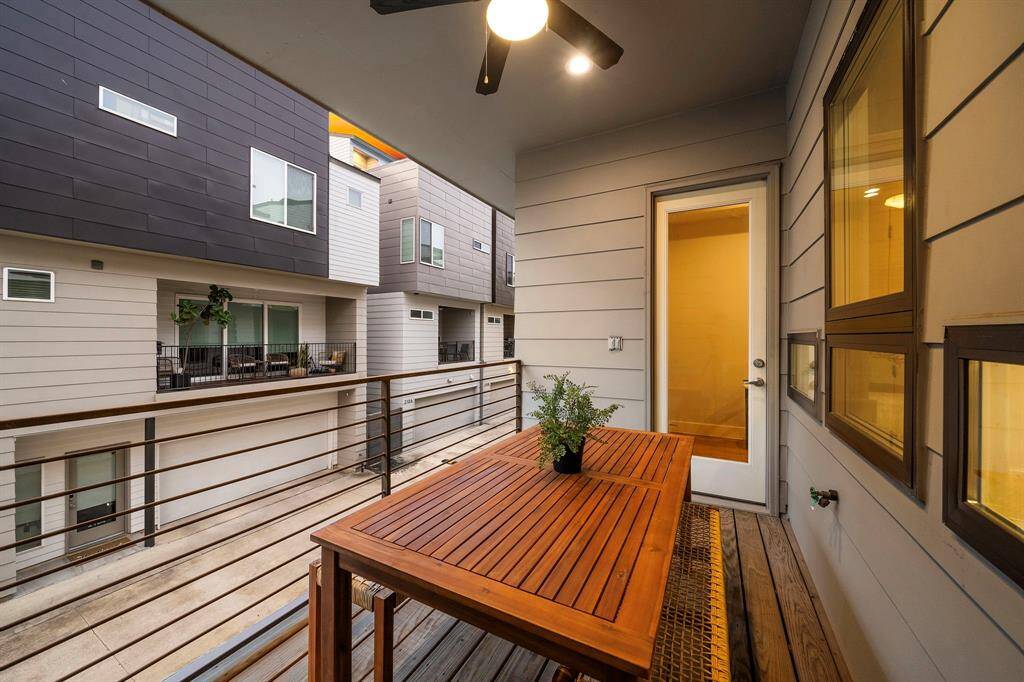 The spacious layout easily accommodates outdoor dining, creating an inviting spot to enjoy fresh air or unwind within the privacy of a gated urban enclave.