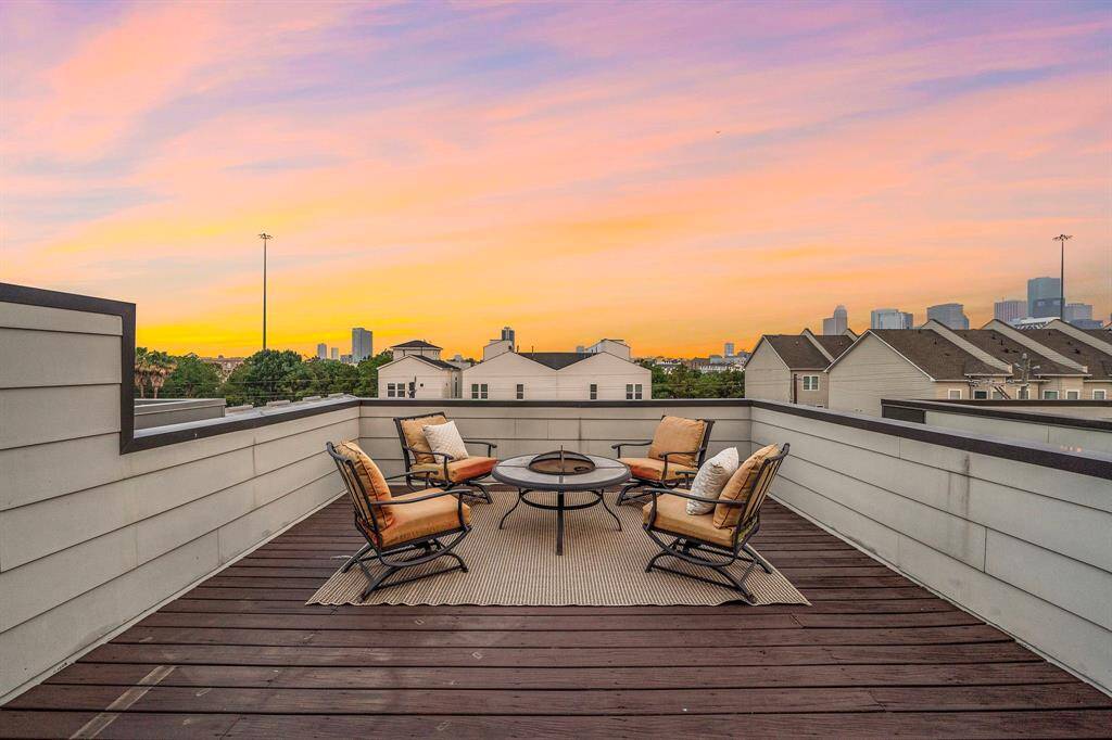 Expansive rooftop terrace delivers premium Downtown skyline views and plenty of space for open-air lounging or entertaining. The durable decking, privacy walls, and ample seating area create an inviting setting for enjoying low-maintenance urban living in a private, gated community.