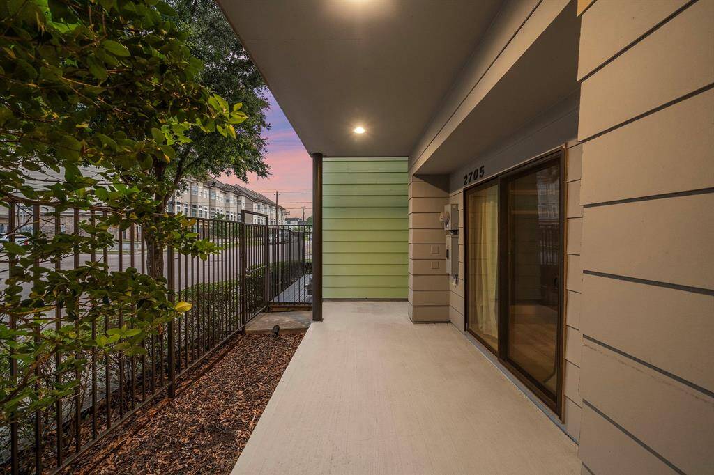 Enjoy added privacy and security in the gated front courtyard, featuring low-maintenance landscaping and a spacious covered entry.