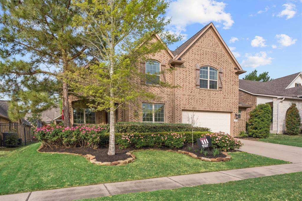 Stunning Curb Appeal! This beautifully landscaped home welcomes you with a spacious front patio—perfect for relaxing and enjoying the neighborhood. The lush greenery and charming design make a lasting first impression!