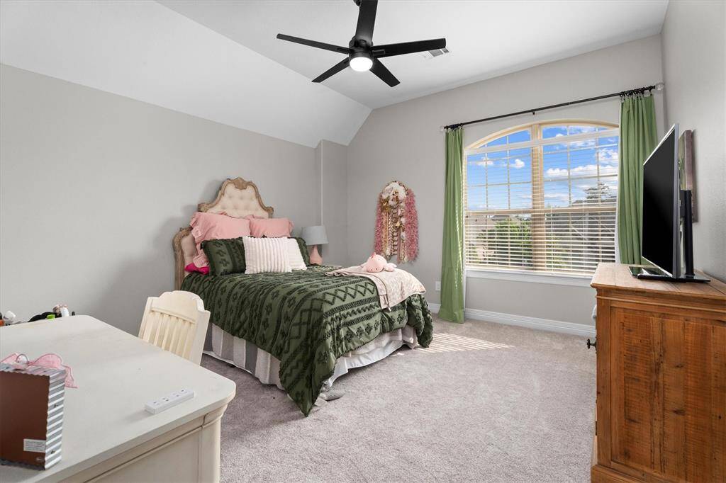This spacious upstairs bedroom offers plenty of room to relax, complete with a generously sized closet for all your storage needs. It’s conveniently connected to a Hollywood-style bathroom, featuring a shared layout that provides private access from both adjoining bedrooms – perfect for flexibility and convenience.