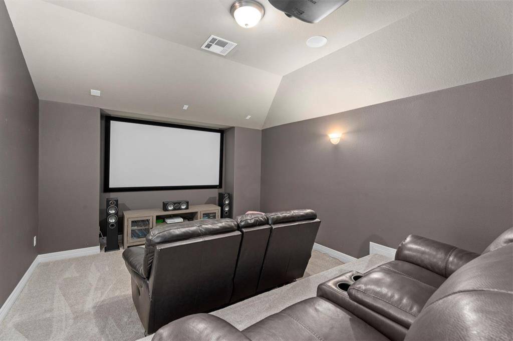 The media room is thoughtfully designed for the ultimate entertainment experience. With its ideal setup, this dedicated space is perfect for movie nights, gaming, or watching the big game in comfort and style.