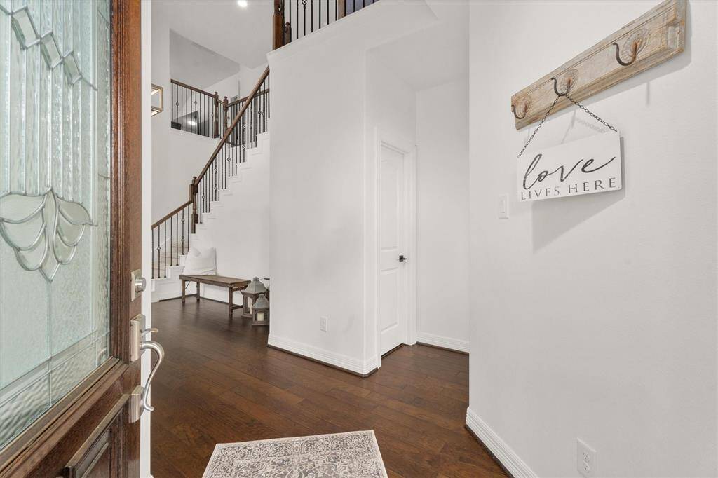 Step inside and be greeted by soaring ceilings and an abundance of natural light. This elegant entryway sets the tone for the beauty and openness found throughout the home!