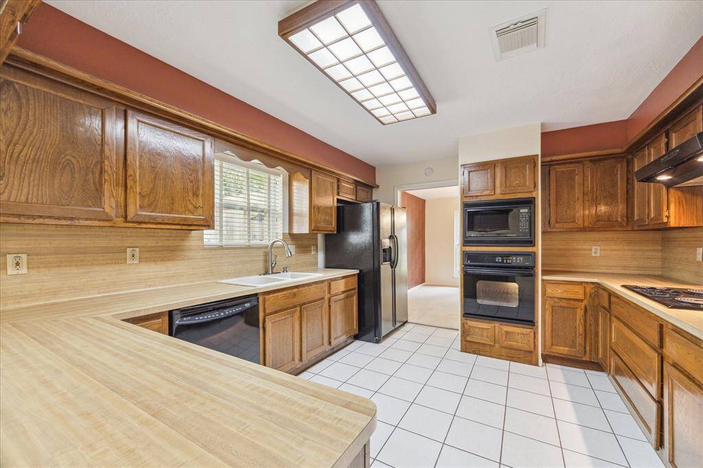 The kitchen has ample cabinet space and a large pantry. You’ll have plenty of space for all of your favorite kitchen gadgets here.
