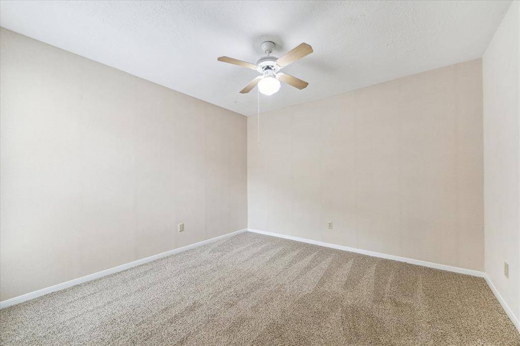 Soft neutral finishes, wonderful natural light, ample closet space, and easy access to the full bathroom make this bedroom a comfortable and convenient retreat for family or guests.