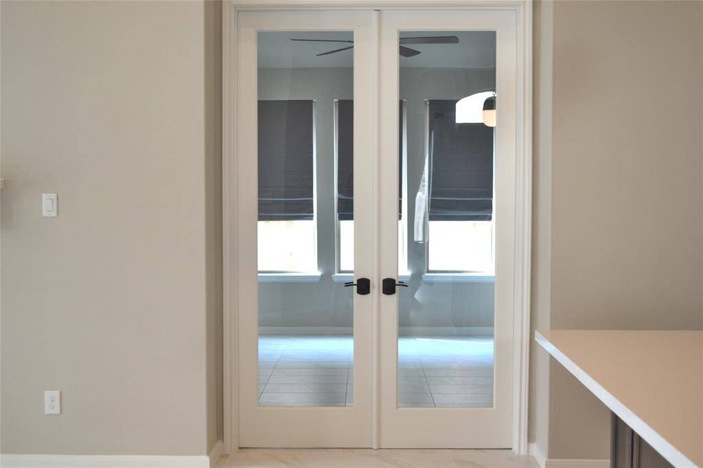 Study with beautiful doors and matte Black Schlage levers