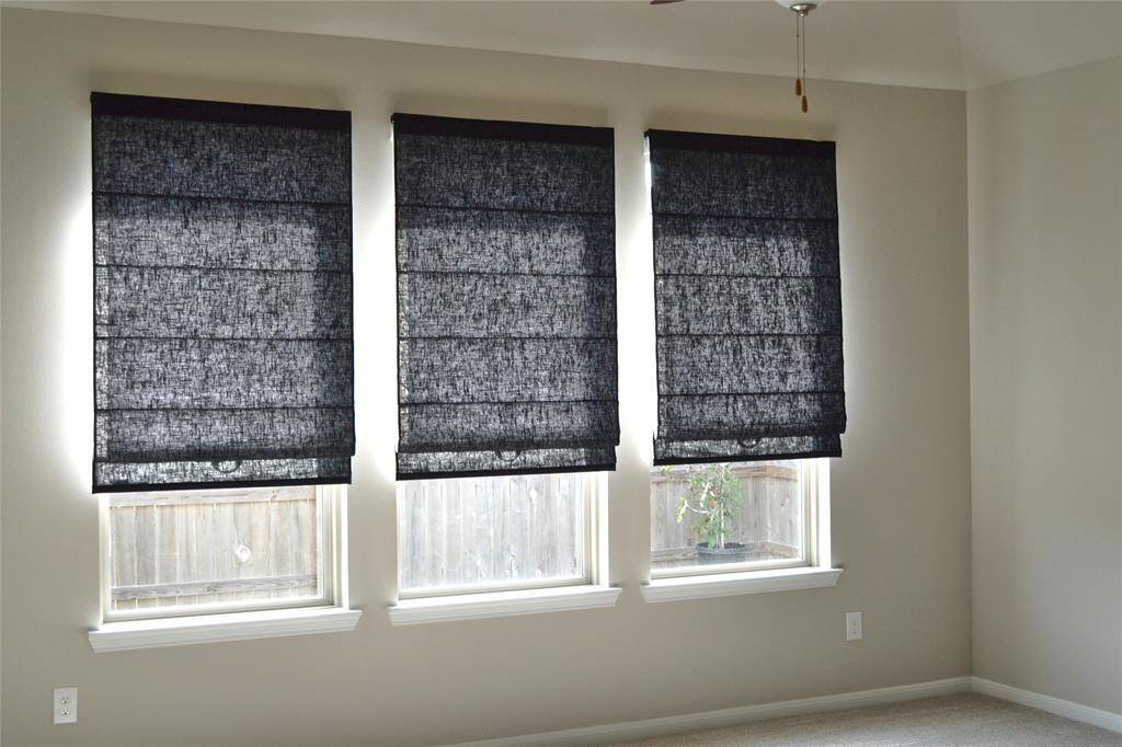 Spacious Gameroom Features Custom Roman shades