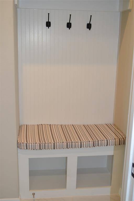 Mud Room seating with matte black hooks