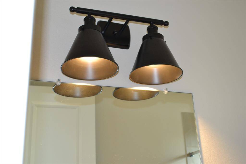 Matte black lighting . High end designer  in Crystorama lighting in bathroom.