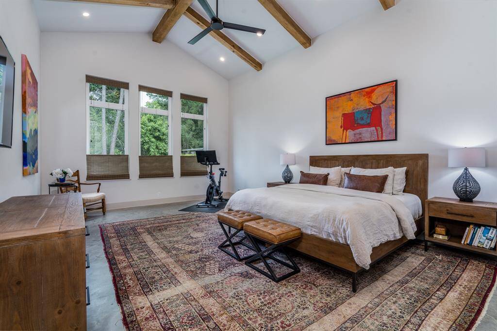Primary Suite-- Cathedral style ceilings and a wonderful view of the backyard
