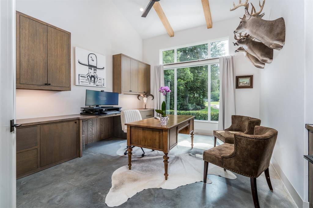 Home Office area with views of the front yard, cathedral style ceilings with exposed beams