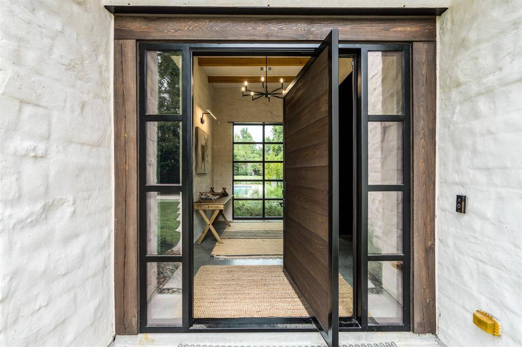 You'll love the statement this 5'x8' Pivot entry door will make....Call today to come see it all