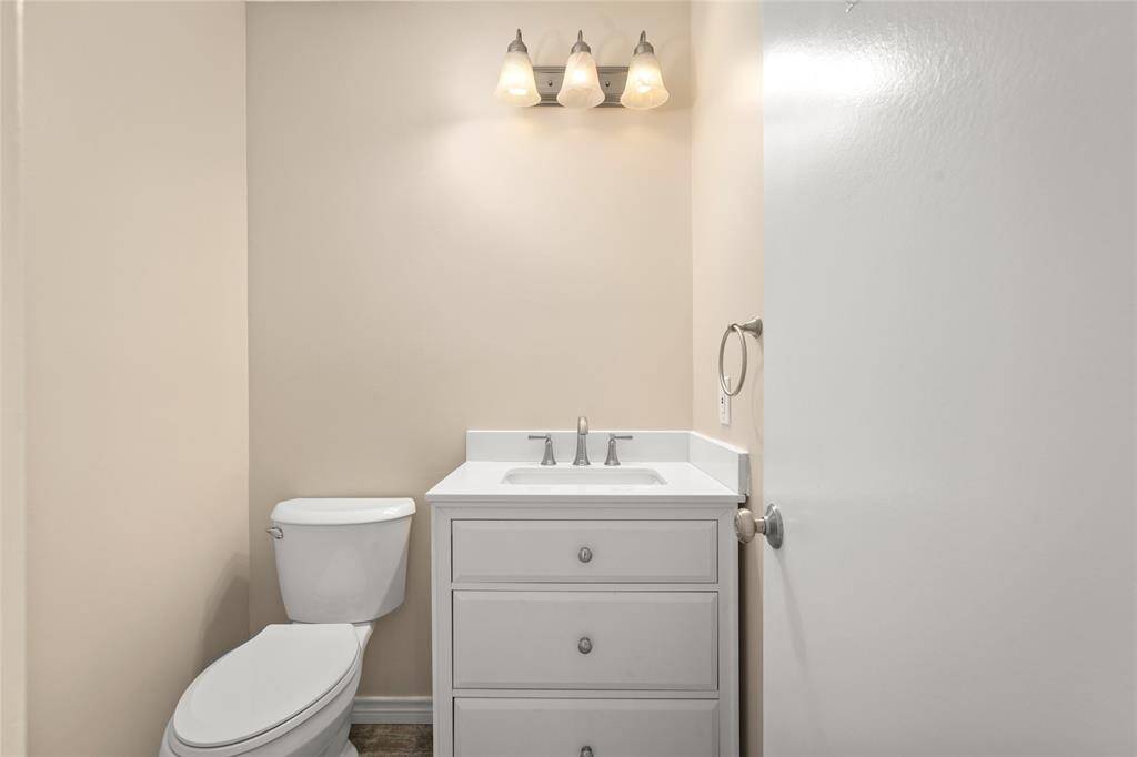 Half bath, ideally situated for guest access without intruding on private living areas.
