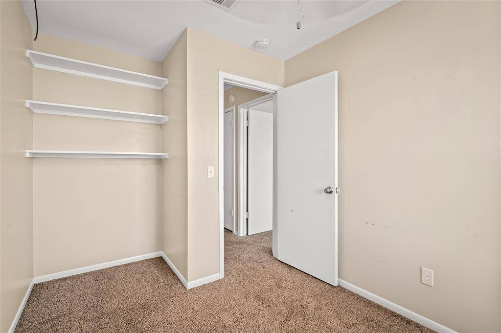 Another perspective of the bedroom looking into the door and hallway.