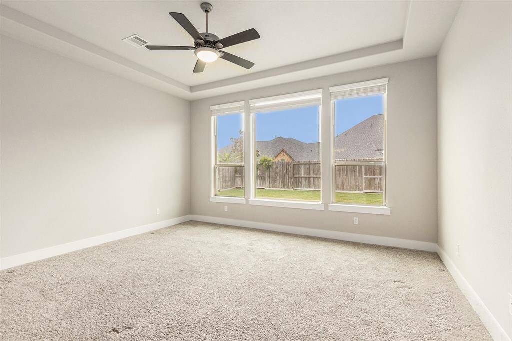 Luxurious primary suite with abundant space, natural light, and a spa-like en-suite bathroom for your ultimate retreat.