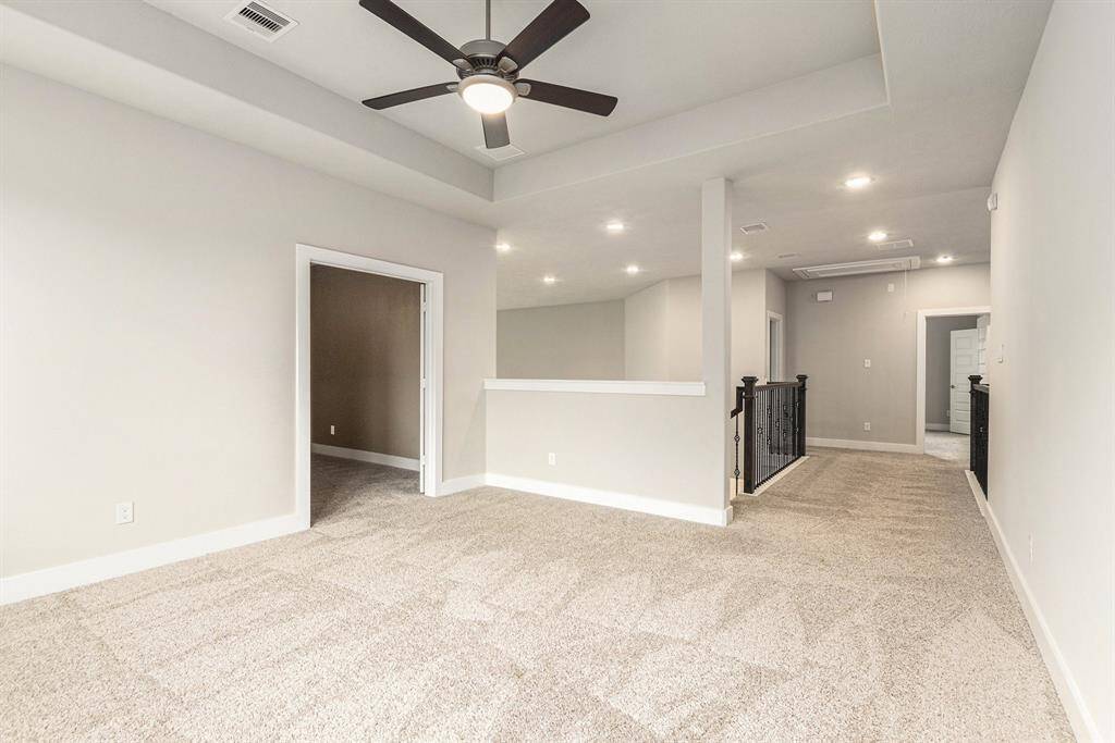 Flexible upstairs game room or second living area—perfect for movie nights, gaming, or a playroom.