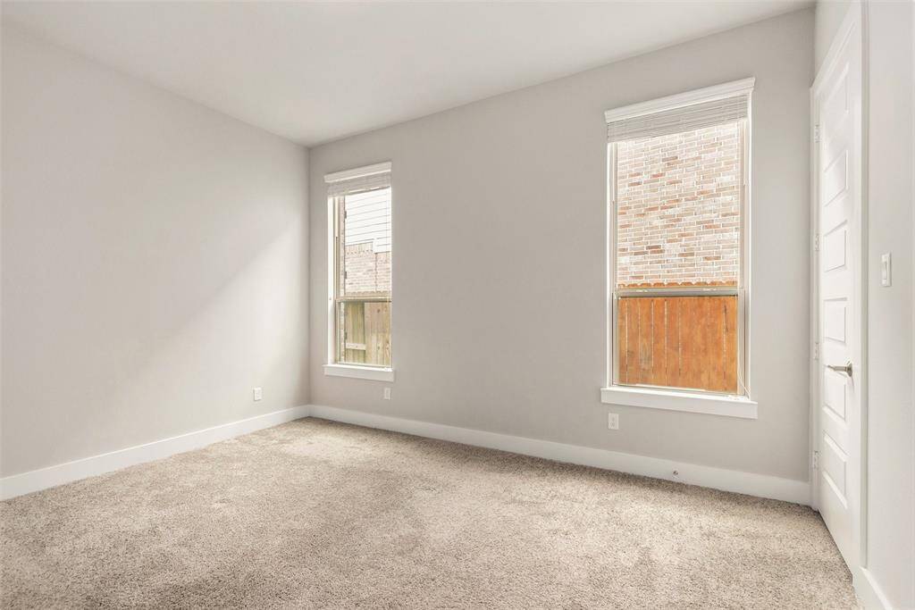 Convenient downstairs guest bedroom with private bath access—perfect for visitors or multi-use needs.