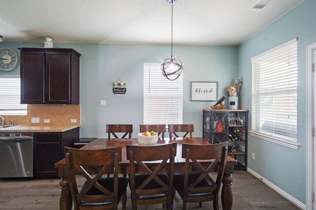 Breakfast area is large enough to fit a table for six.